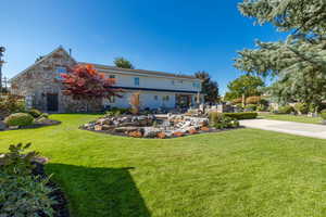 View of front of property featuring a front lawn