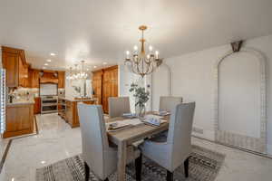 Dining room with a notable chandelier