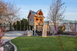 Exterior space featuring a mountain view and a yard