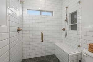 Bathroom with toilet and a shower with door