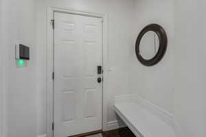 Mudroom with dark hardwood / wood-style floors