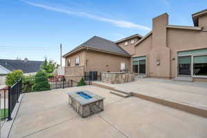 View of patio / terrace with a fire pit and central air condition unit