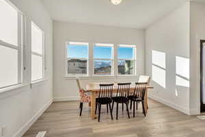 Dining area with light wood-type flooring