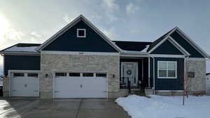 View of front of property featuring a garage