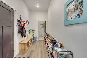 Mudroom with light wood-type flooring