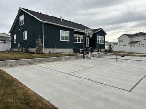 View of basketball court with pickle ball court and a yard