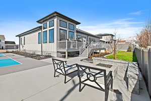 Back of property featuring a patio area and a deck