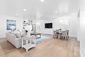 Living room with light hardwood / wood-style floors