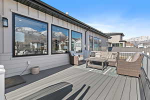 Deck featuring an outdoor hangout area and a mountain view