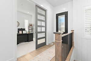 Entryway with french doors and wood-type flooring