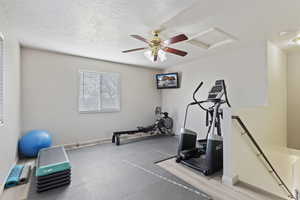 Exercise room featuring a textured ceiling