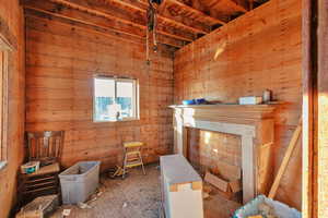 Miscellaneous room with beam ceiling and wooden ceiling