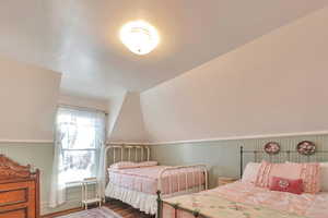 Bedroom featuring dark wood-type flooring