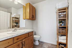 Bathroom featuring toilet and vanity