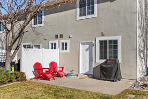 Rear view of house featuring a patio