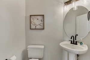 Bathroom featuring sink and toilet