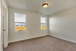 Unfurnished room featuring carpet floors