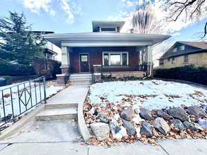 View of front of house with covered porch