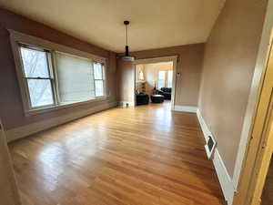 Unfurnished dining area with plenty of natural light and light wood-type flooring