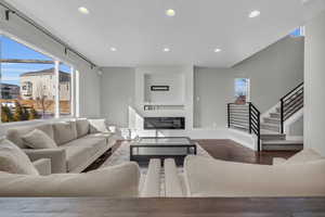 Living room with dark wood-type flooring