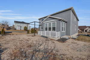 Back of property with covered porch