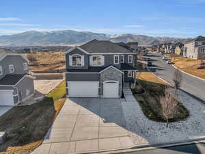 View of front property featuring a garage and a mountain view