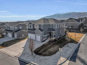 View of front facade featuring a garage and a mountain view