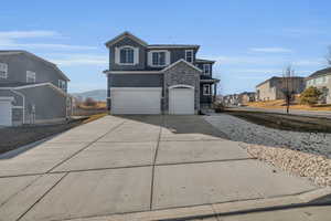 Front of property featuring a garage