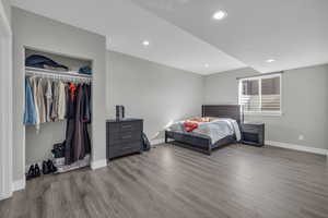 Bedroom with light wood-type flooring and a closet