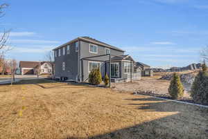 Exterior space featuring a yard