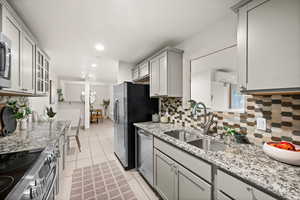 With Granite Countertops and Designer Cabinets