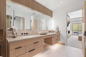 Bathroom featuring tile patterned flooring and vanity