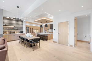 Dining area featuring a chandelier, light hardwood / wood-style floors, and sink