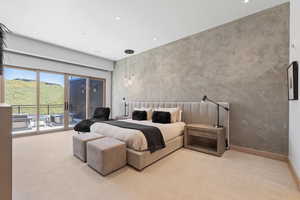 Bedroom with light colored carpet and access to exterior