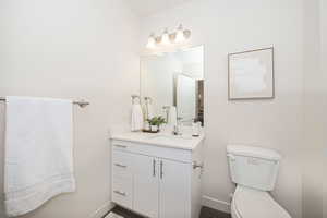 Bathroom with toilet and vanity