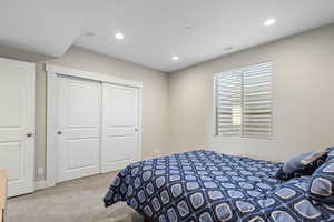 Bedroom with a closet and carpet flooring