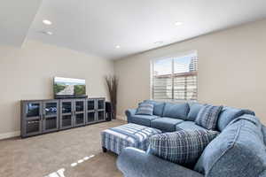 Living room featuring light colored carpet