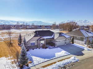 View of front of house featuring a mountain view and a garage