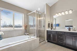 Bathroom with vanity, independent shower and bath, and tile patterned flooring