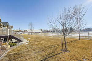 View of yard with a deck