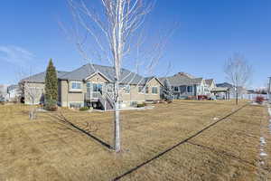 View of front of house featuring a front lawn