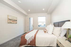 Carpeted bedroom featuring access to outside