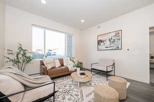 Living room with hardwood / wood-style floors