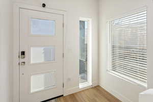 Entryway with light hardwood / wood-style flooring