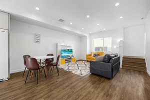 Living room featuring dark wood-type flooring