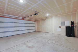 Garage with electric panel and a garage door opener Soft Water