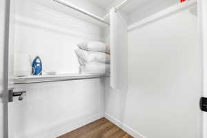 2nd Bedroom Walk in closet featuring dark hardwood / wood-style floors