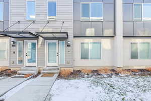 View of snow covered property entrance