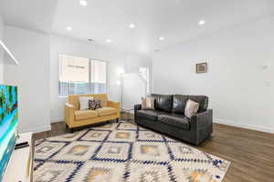 Living room featuring dark hardwood / wood-style flooring