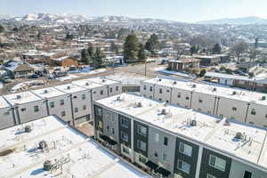 Birds eye view of property with a mountain view